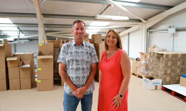 Paul Beatty from Smile4You and Natalie Cressman from eFactor posing for a photograph at the Smile4You warehouse