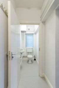 A Grimsby retail unit with a bathroom featuring a toilet and sink.