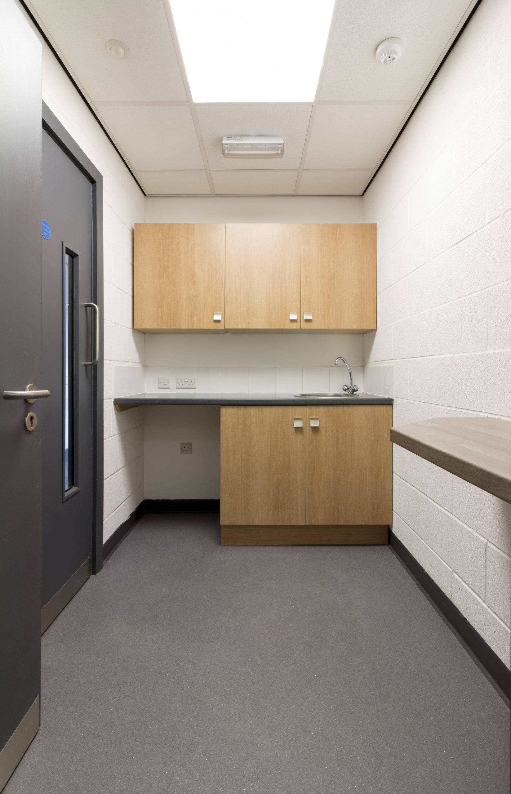 An industrial unit in Grimsby's Enterprise Village with cabinets and a sink.