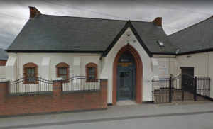 A Google street view of an office building with a gate in Grimsby.
