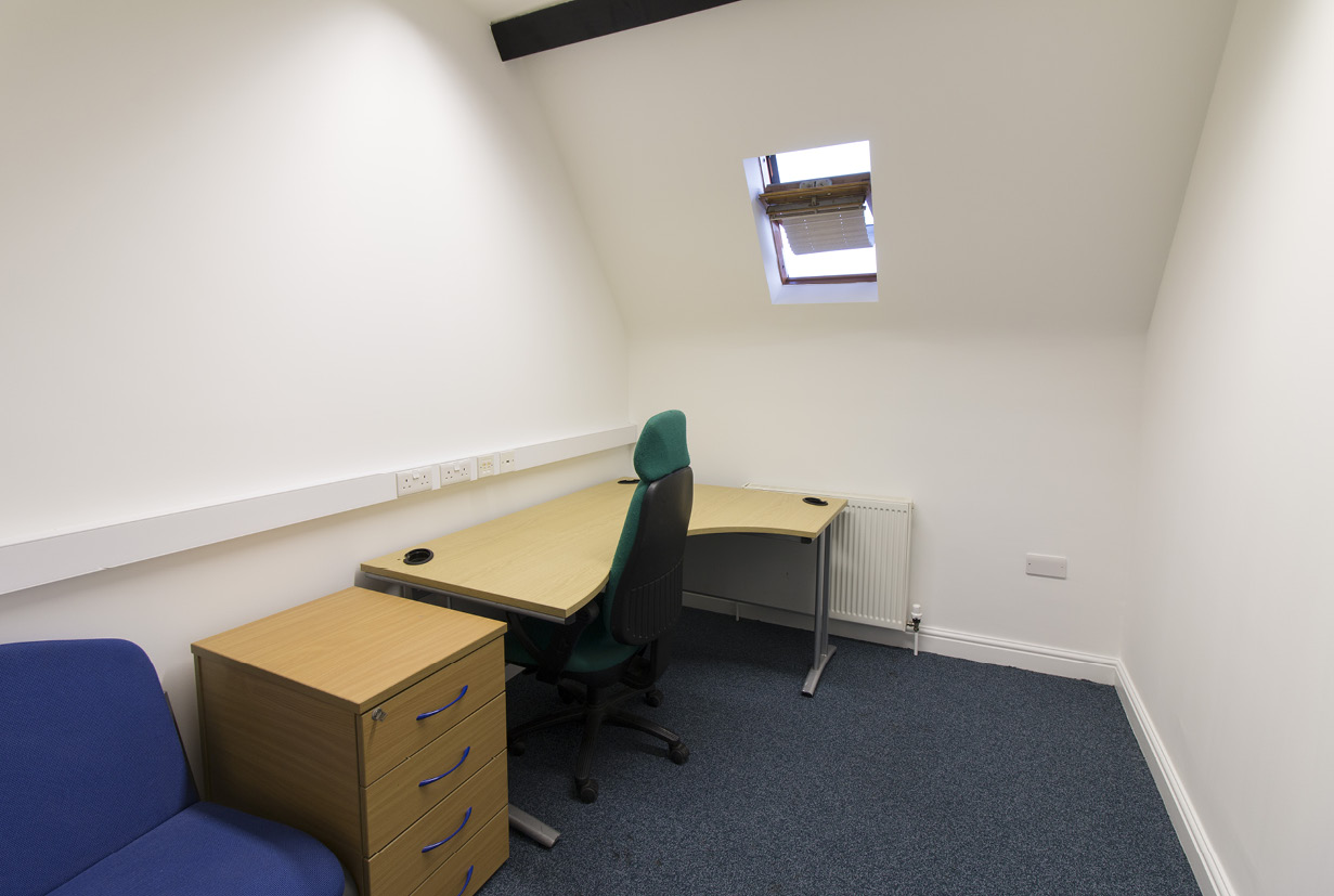 A small office at F1, 84 Wellington Street, Grimsby with a desk and chair.