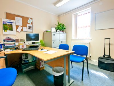 An office with a desk and chairs located at 84 Wellington Street in Grimsby (Office - G1).